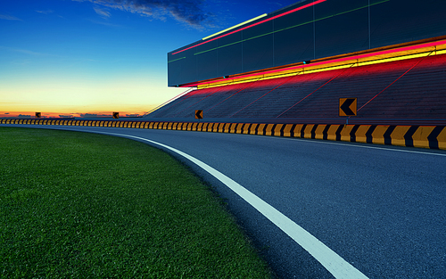 Evening view of empty asphalt racing track with 3d rendering auditorium. Mixed media