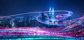 Night city with abstract gradient blue and red glowing light trail surround the city ,Smart city big data connection technology concept .
