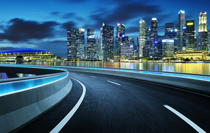 Highway overpass modern Singapore city skyline background . Night scene .