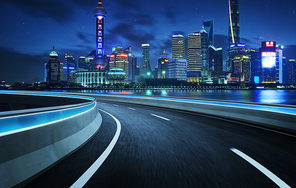 Highway overpass modern Shanghai city skyline background . Night scene .
