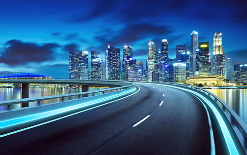 Highway overpass modern Singapore city skyline background . Night scene .