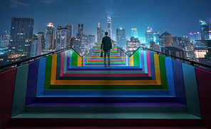 Successful businessman climbing on colorful stair to beautiful night cityscape, ambitions concept . Photo manipulation .
