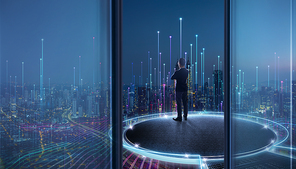 Back view of successful businessman in suit  standing on round open stage rooftop looking at beautiful night city with abstract lighting growing effect . Dream big concept .
