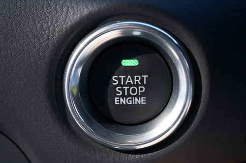 Closeup of a modern car interior with Start Stop engine button