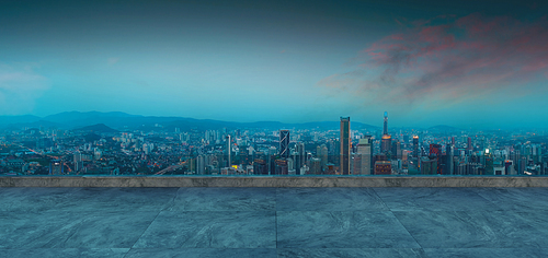 Panoramic view of empty concrete floor of rooftop with city skyline, Early morning scene