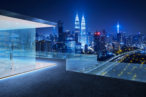 Glass railings and tile floor rooftops with night city skyline background .