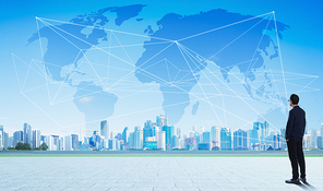 International business concept with businessman on city skyline background with network and map