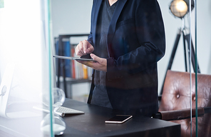 Businessman using digital tablet to work