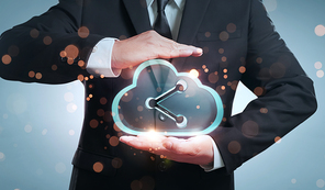 Businessman holding transparent digital cloud storage icon