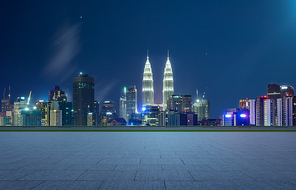 Empty square ground floor with city skyline background  . Night scene .