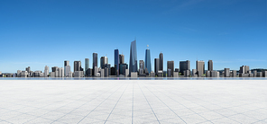Panoramic view of empty concrete tiles floor with city skyline. Daytime scene. 3d rendering