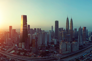 Future 3d modern jigsaw puzzle design skyscraper mix in sunrise Kuala Lumpur city skyline , future vision of modern city , mixed media .
