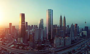 Future 3d modern neon light design skyscraper mix in sunset Kuala Lumpur city skyline , future vision of modern city , mixed media .