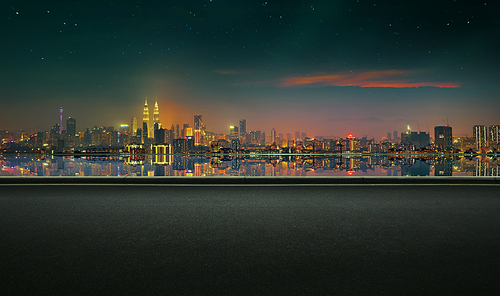 Panoramic view of asphalt road side with beautiful Kuala Lumpur city waterfront skyline. Night scene .