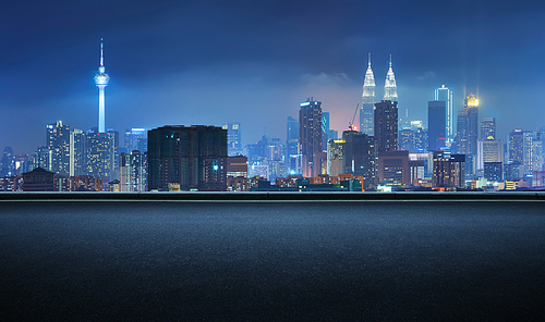 Side view asphalt road on night , Kuala Lumpur city .