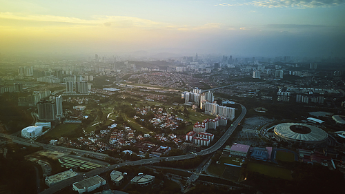 Panorama cityscape view in the middle of Kuala Lumpur city center , early morning with little mist , Malaysia .