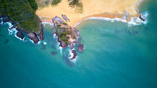 Aerial view of beach with rocky and waves, beautiful tropical beach located at Terengganu, Malaysia