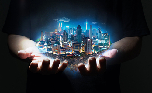 Unknown hand holding fantasy island floating in the air with modern city skyline , Night scene .