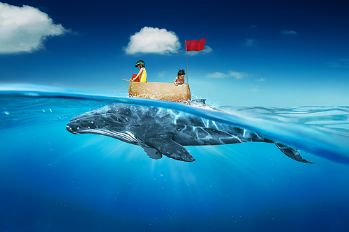 Sisters sea travel in the sea with cardboard ship and whale . Abstract dreams travel and success concept .