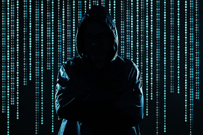 Unrecognizable hacker using mobile phone portrait, mobile phone security and technology crime concept .