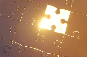 The last missing piece with light golden glow effect . Business strategy concept .