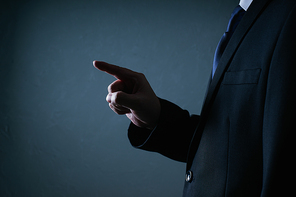 Businessman press gesture pose . Low key lighting .