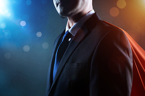 Closeup Businessman in suit and cape hero . bokeh and light flare effect apply .
