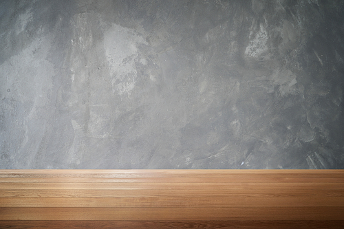 Wood table and  cement wall background