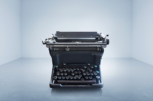 Old vintage retro black Typewriter on empty space