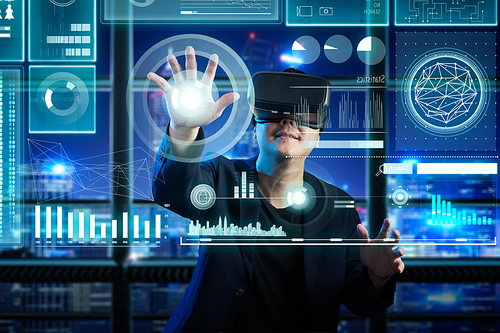 Businessman wearing virtual reality glasses search financial solution with futuristic computer screen , future e-business concept .