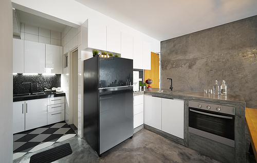 Modern,bright,clean,kitchen interior with concrete island in a loft style house , Interior photography.