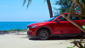 Kuala Lumpur, Malaysia - July 11, 2019 : New red Mazda CX 5  crossover SUV park at beach side . Mazda CX 5  is one of Malaysian favorite SUV car .