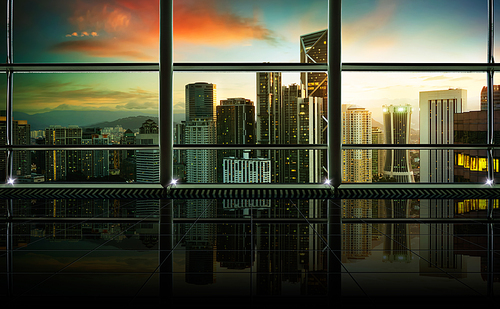 Modern empty and clean office interior with glass windows , Modern city skyline background , early morning scene .