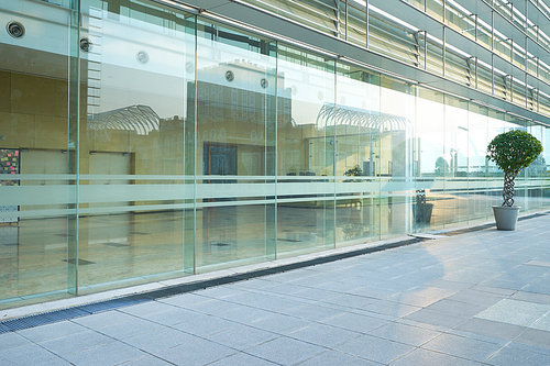 Modern glass facade business office building exterior with floor