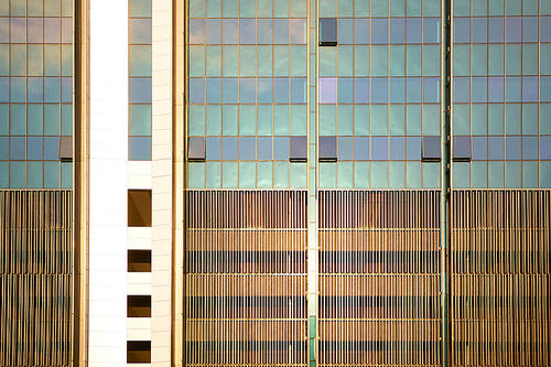 Abstract close up of square layout modern office with steel and glass facade