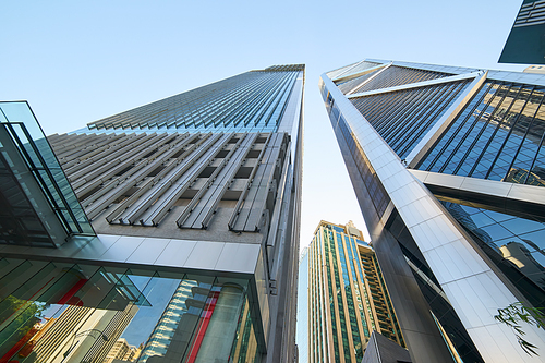 Low angle shot of modern glass city buildings with clear sky background. KL,Malaysia.