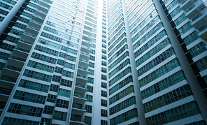 Apartment building.Multistoried modern and stylish living block of flats. Real estate and new house.