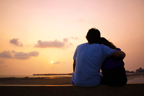 Romantic Mature Couple Enjoying at Sunset on the Beach in Sepang,Malaysia