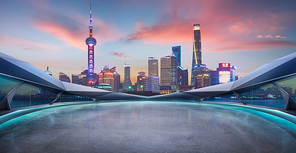 Panoramic view of futuristic geometric shapes design empty floor with Shanghai city skyline . Sunset scene .