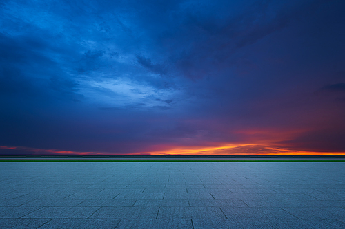 Empty floor with dramatic sunset sky , Horizontal format .