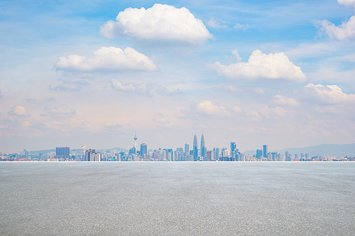 Panoramic city skyline  with empty concrete  floor .