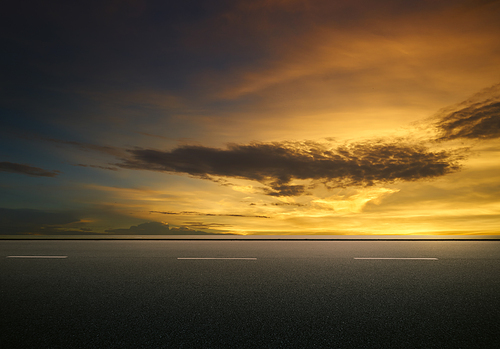 Asphalt road with dramatic sunrise sky , Horizontal format .