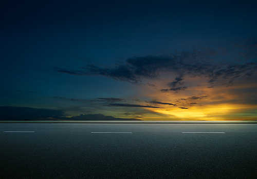 Asphalt road with dramatic sunrise sky , Horizontal format .
