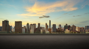 Asphalt road side with beautiful Bangkok city skyline. evening scene