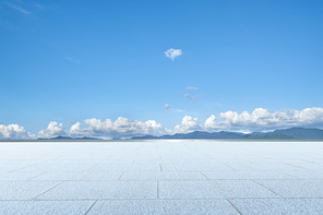 Empty  floor in front of blue sky .