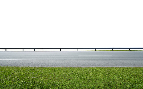 Asphalt road with railings and green grass，isolated on white with clipping path. Side angle view