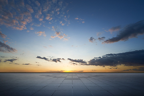 Empty ground floor with beautiful sunset sky .