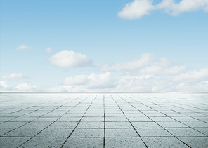 Empty  floor in front of blue sky .