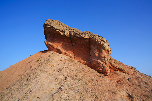 Sandstone rocks in the desert againt clear blue sky
