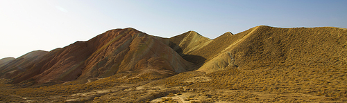 Yellow sandstone hills in desert with clear blue sky , Scenery in Tibet .